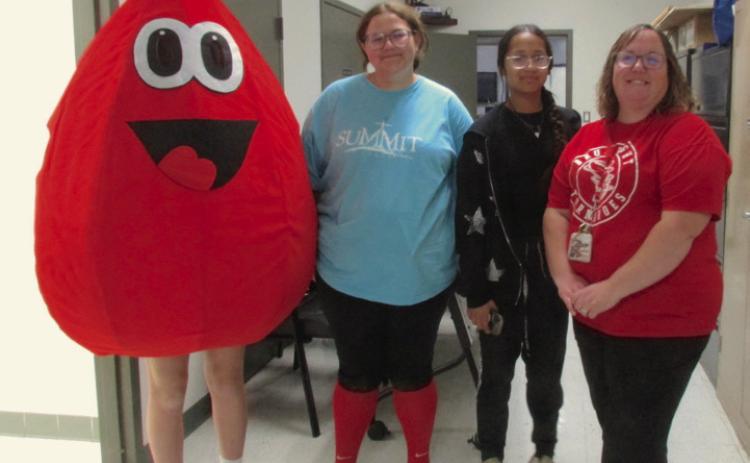 Obi, the blood drop, alongside STUCO members Averi Todd and Lily Haines with their sponsor Lacey Haines. Obi was escorted around Drumright by STUCO member Torin Bray.